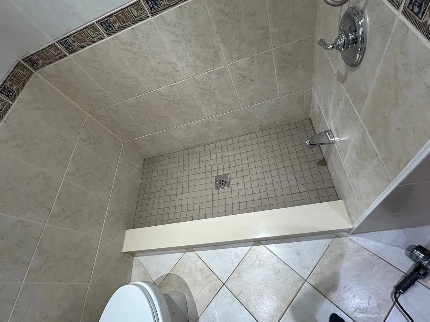 A wider tiled shower view supplied by Waterworks.