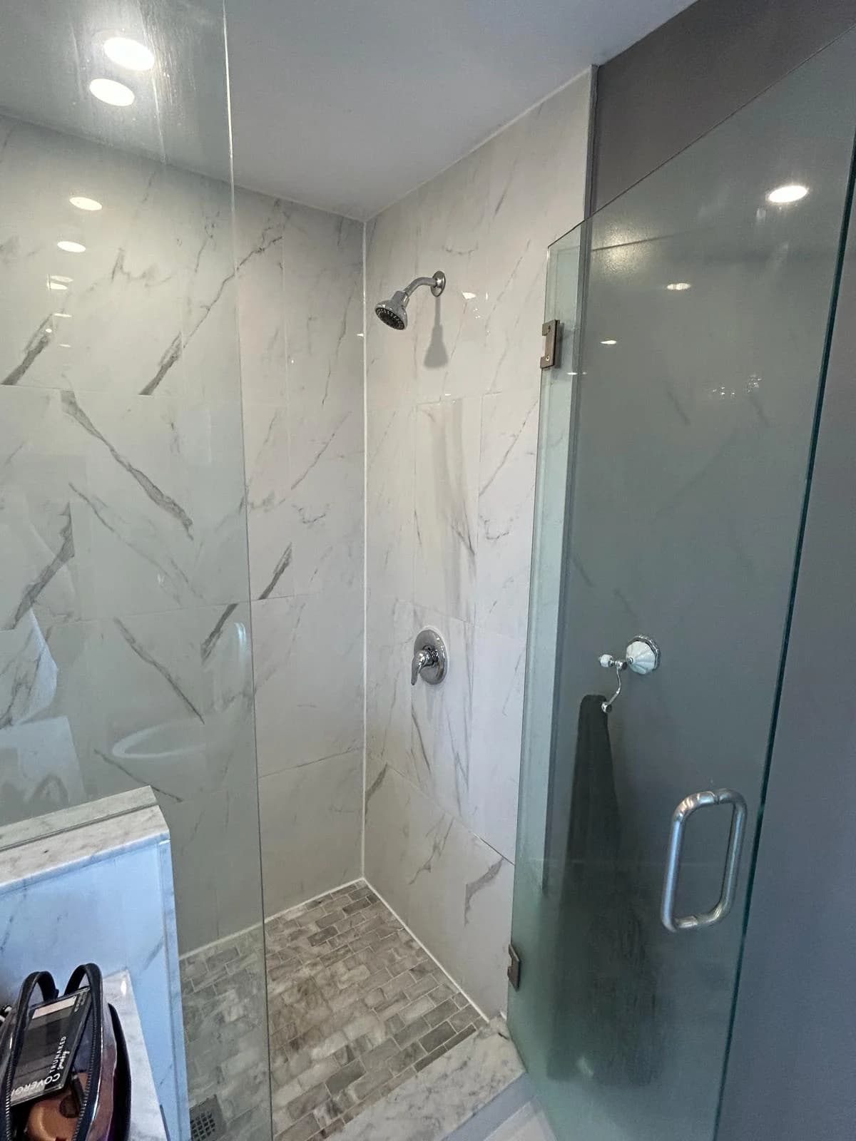 After: the replacement Moen shower valve installed in the same shower.