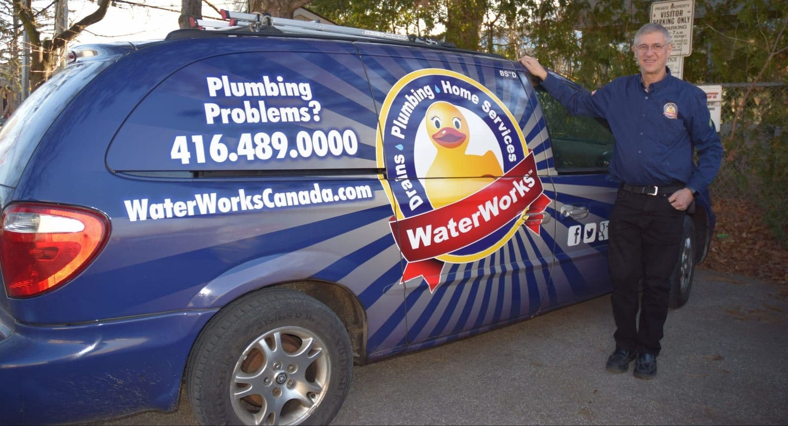 Waterworks service van with the number 416 489 0000 on the side